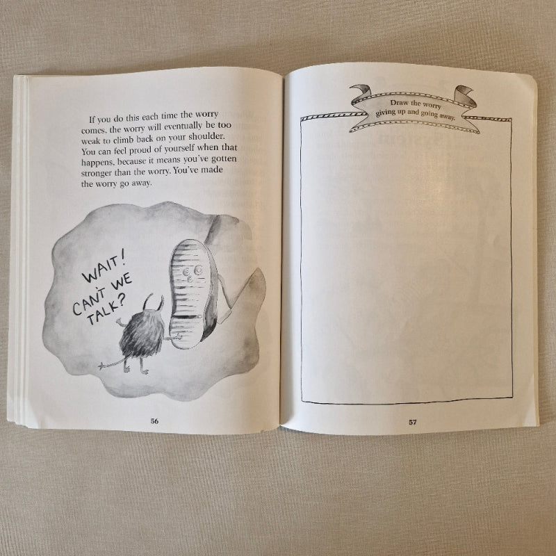 Open book with illustrations and text on a textured surface