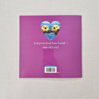 Purple back of book with teddy bear design and text on a textured surface
