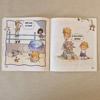 Open book with illustrated pages on a textured beige surface