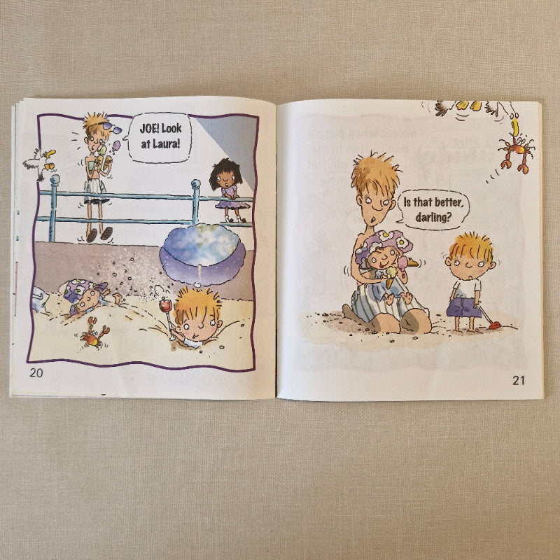 Open book with illustrated pages on a textured beige surface