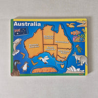 Puzzle with a map of Australia and various animals on a gray background