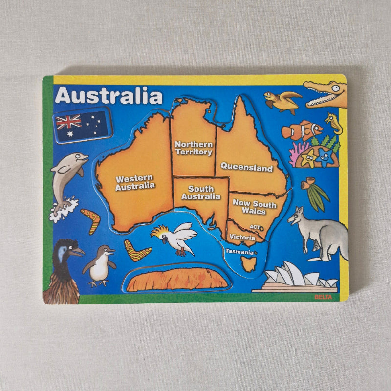 Puzzle with a map of Australia and various animals on a gray background