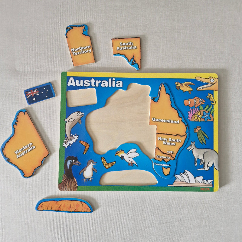 Educational puzzle with Australia map and state shapes on a gray background