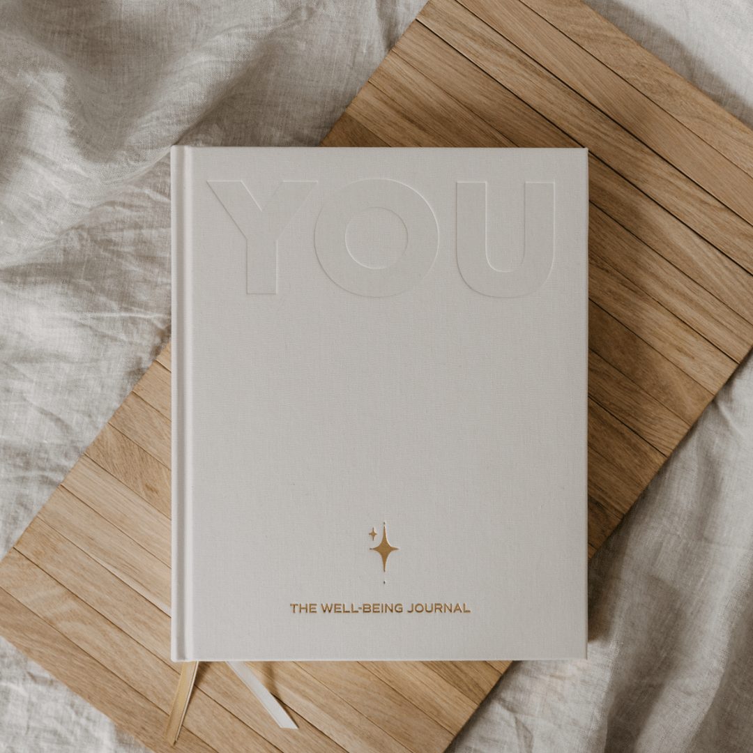 Well-being journal titled 'You' on a wooden surface