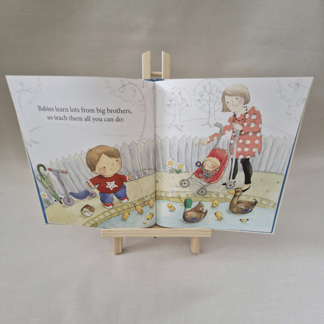Illustrated children's book open to a page with two children playing outdoors.