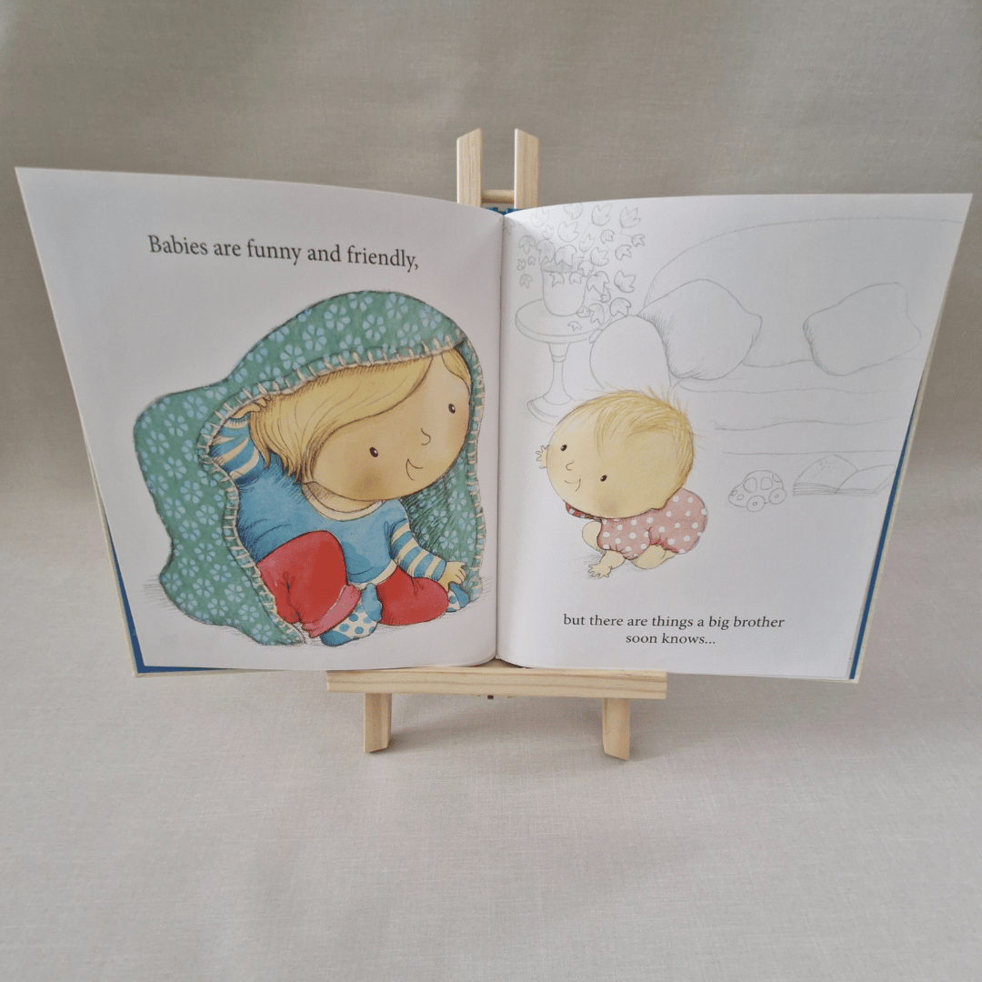 Illustrated book open to a page with two children on a small wooden stand.