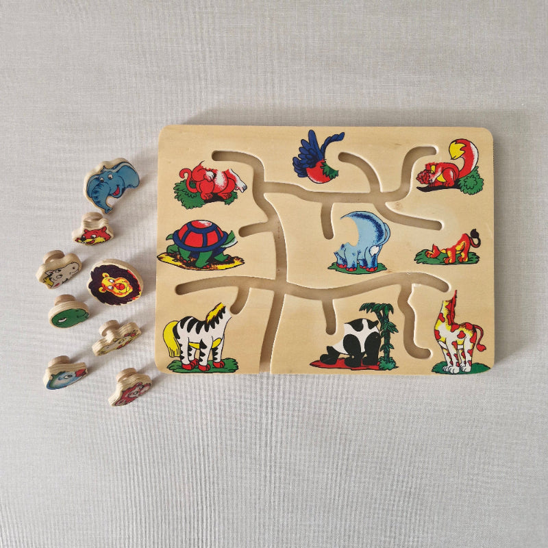 Wooden puzzle with animal figures on a light gray background