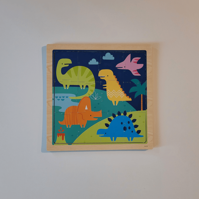 Children's wooden puzzle with colorful dinosaur illustrations on a plain background