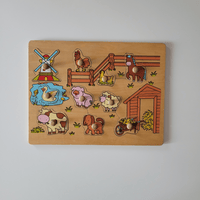 Wooden puzzle with farm animal figures on a plain background