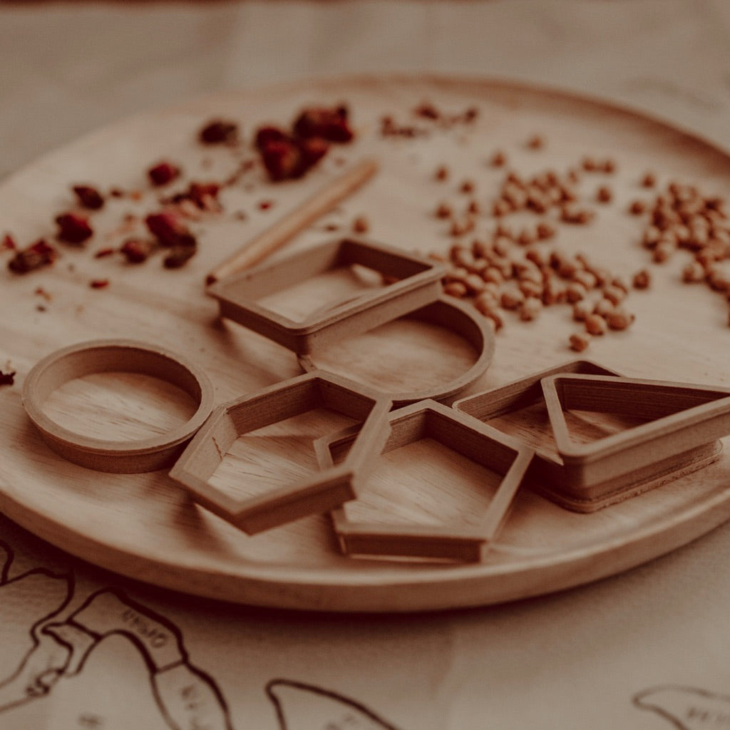shape dough cutters on a wooden board